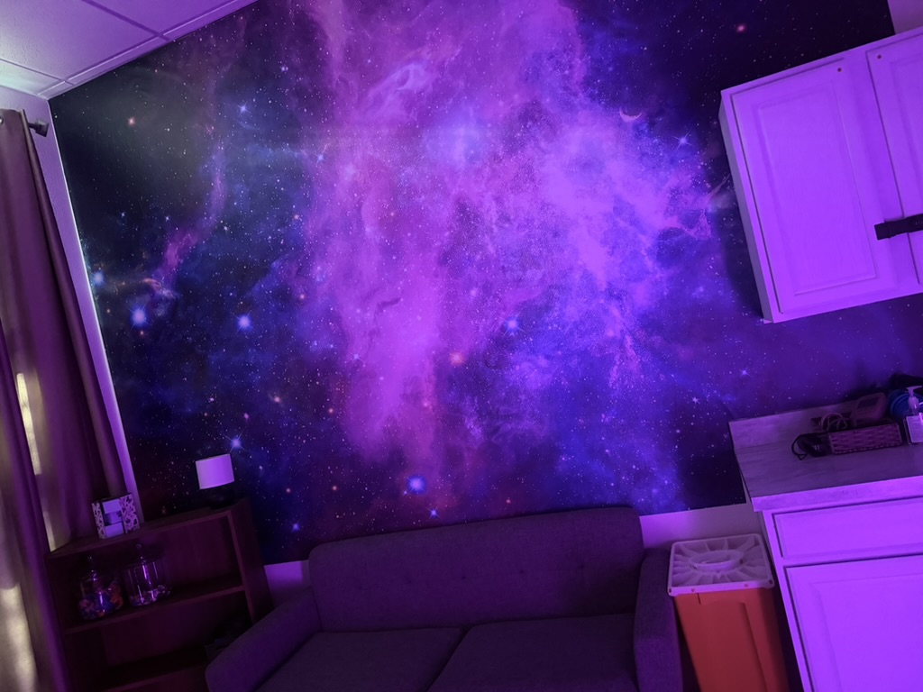 Ketamine treatment room with a purple galaxy wall